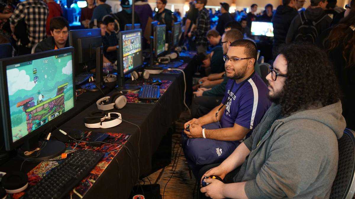 Photo showcasing professional gamers strategizing before a tournament