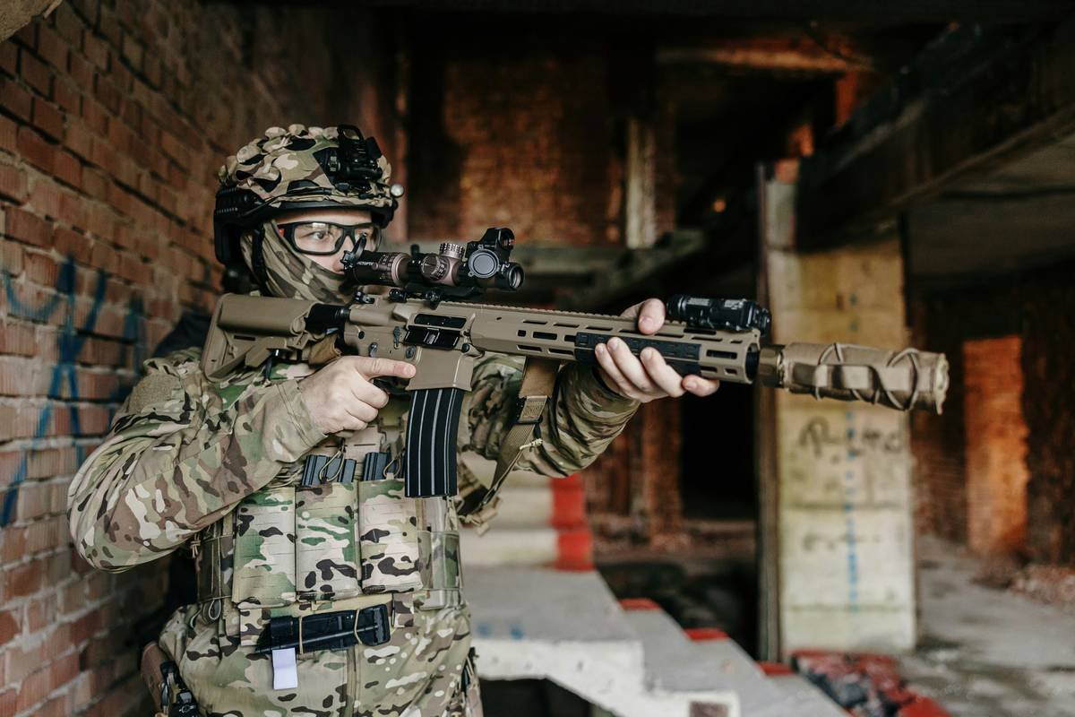 Airsoft player in the new 8Fields Tactical Laser-Cut Plate Carrier with his new Well Pro WE13 DSG.